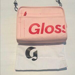 Glossier Soft Pink Cosmetic Case with Bold Red Lettering